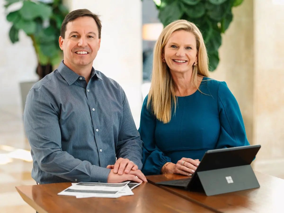 Engage fi CEO and President smiling at the camera.